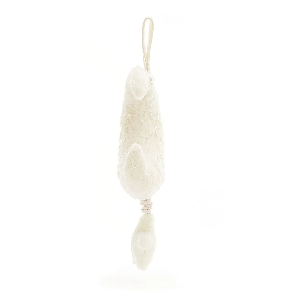 Cream-colored, plush lamb toy hanging.