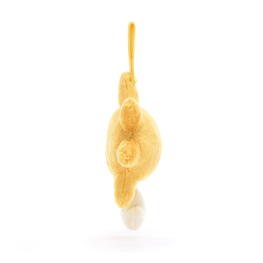 Yellow plush bunny with tail, hanging.