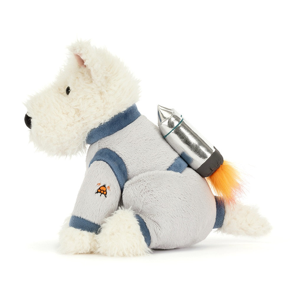 White plush Scottie dog in gray and blue space suit with rocket pack, by Jellycat, side view showing orange flame detail and embroidered patch