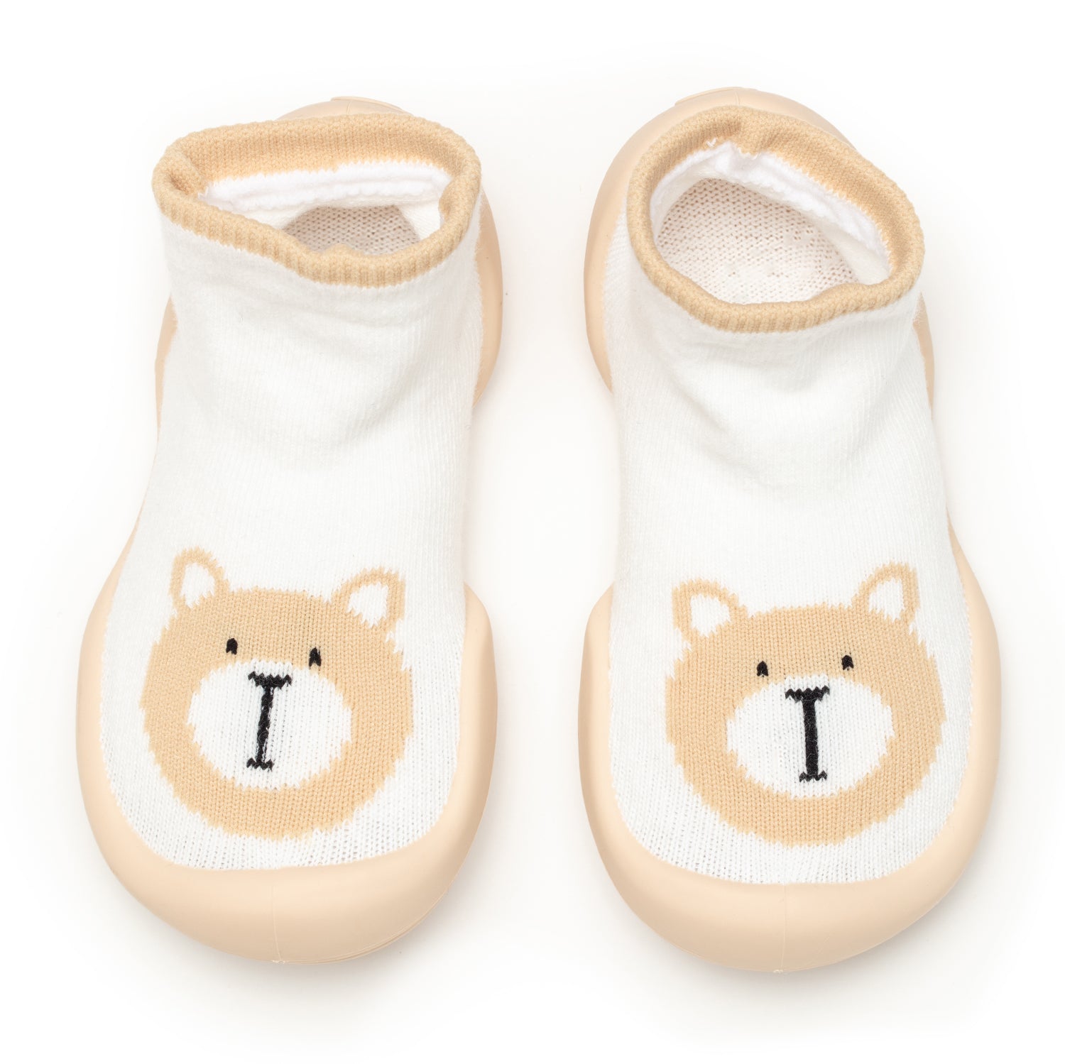 Two white baby socks with tan bear design.