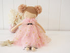 Handmade doll in a pink tulle dress with gold stars, pom-pom hair.