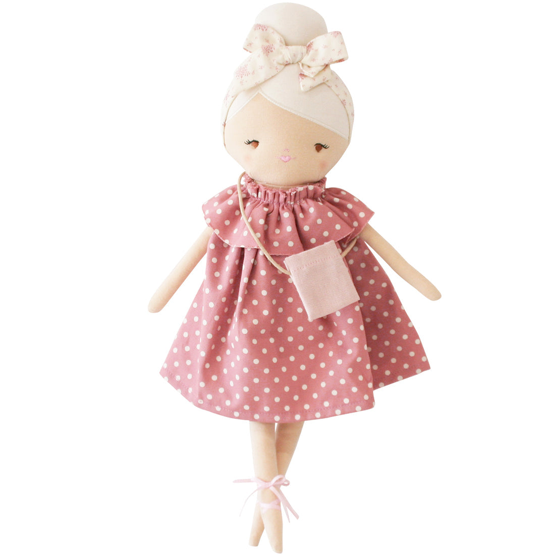 Cloth doll in pink polka dot dress with ballet shoes.
