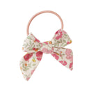 Floral hair tie with pink bow.