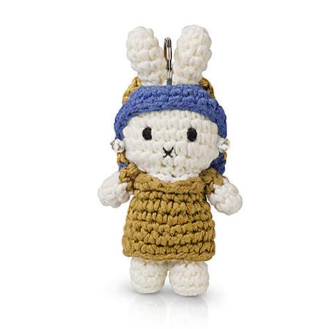 Crocheted bunny keychain with blue headscarf and gold dress.