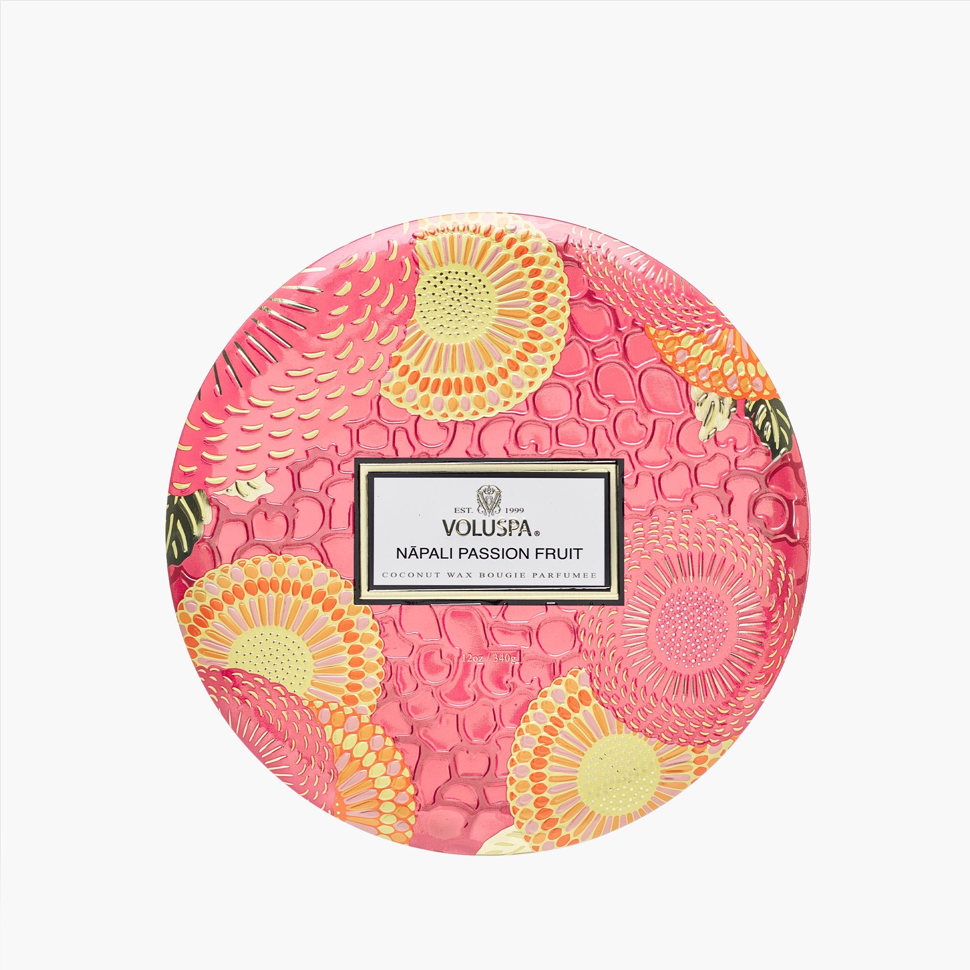 Decorative pink container with floral patterns and Voluspa branding on a white background