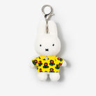 White Miffy plush keychain with a yellow floral shirt.