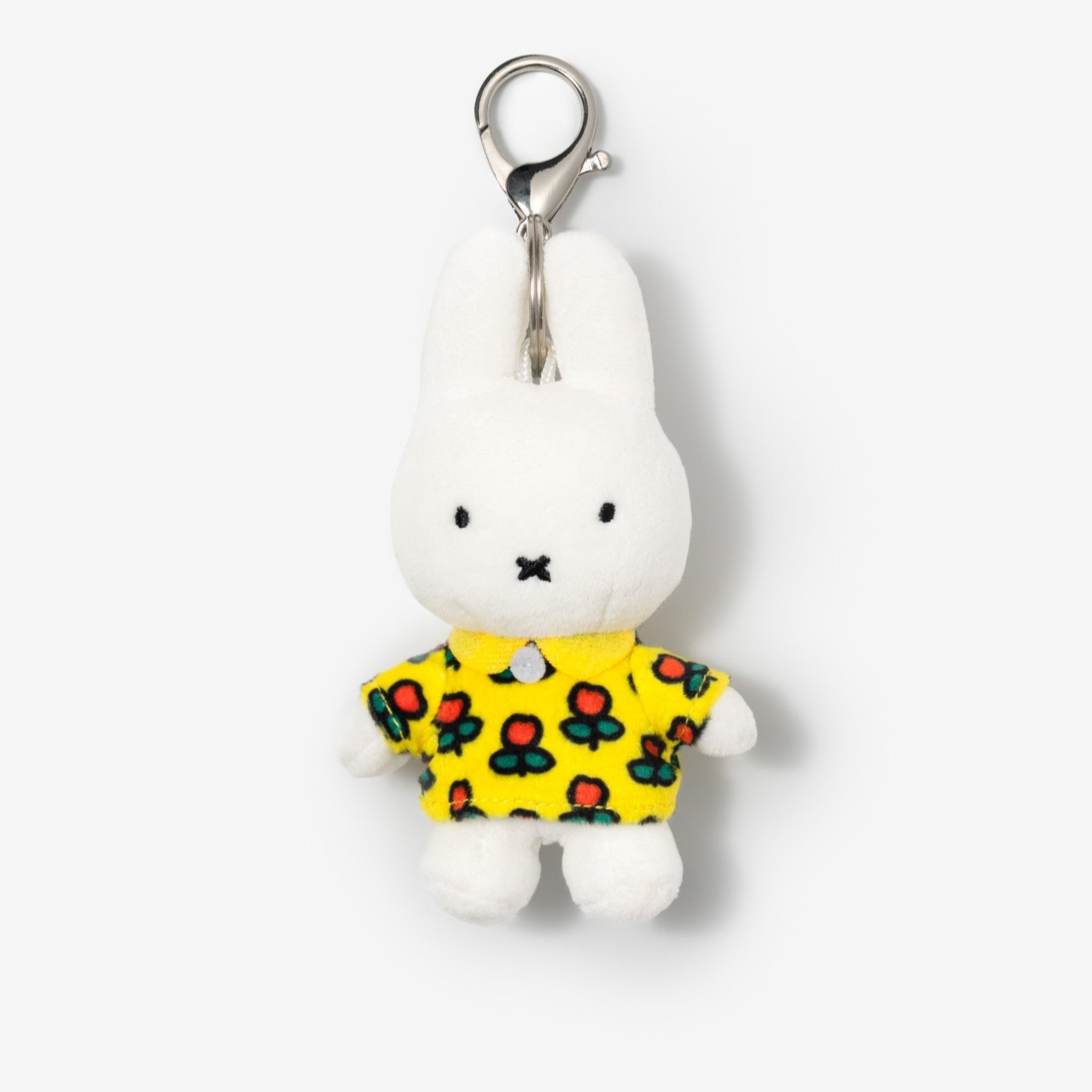 White Miffy plush keychain with a yellow floral shirt.