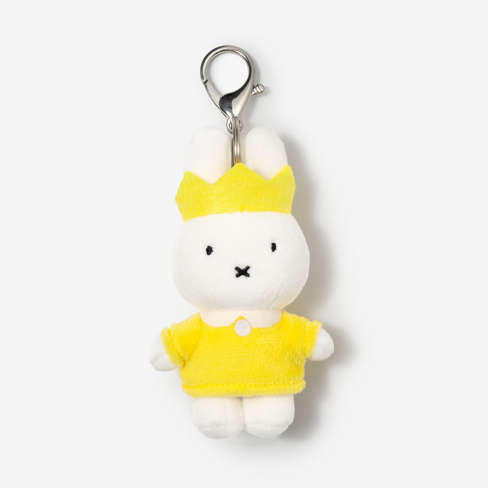White bunny plush keychain with yellow crown and shirt.