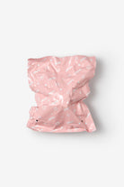 Crinkled pink plastic bag with stars and the word "SMOKO".