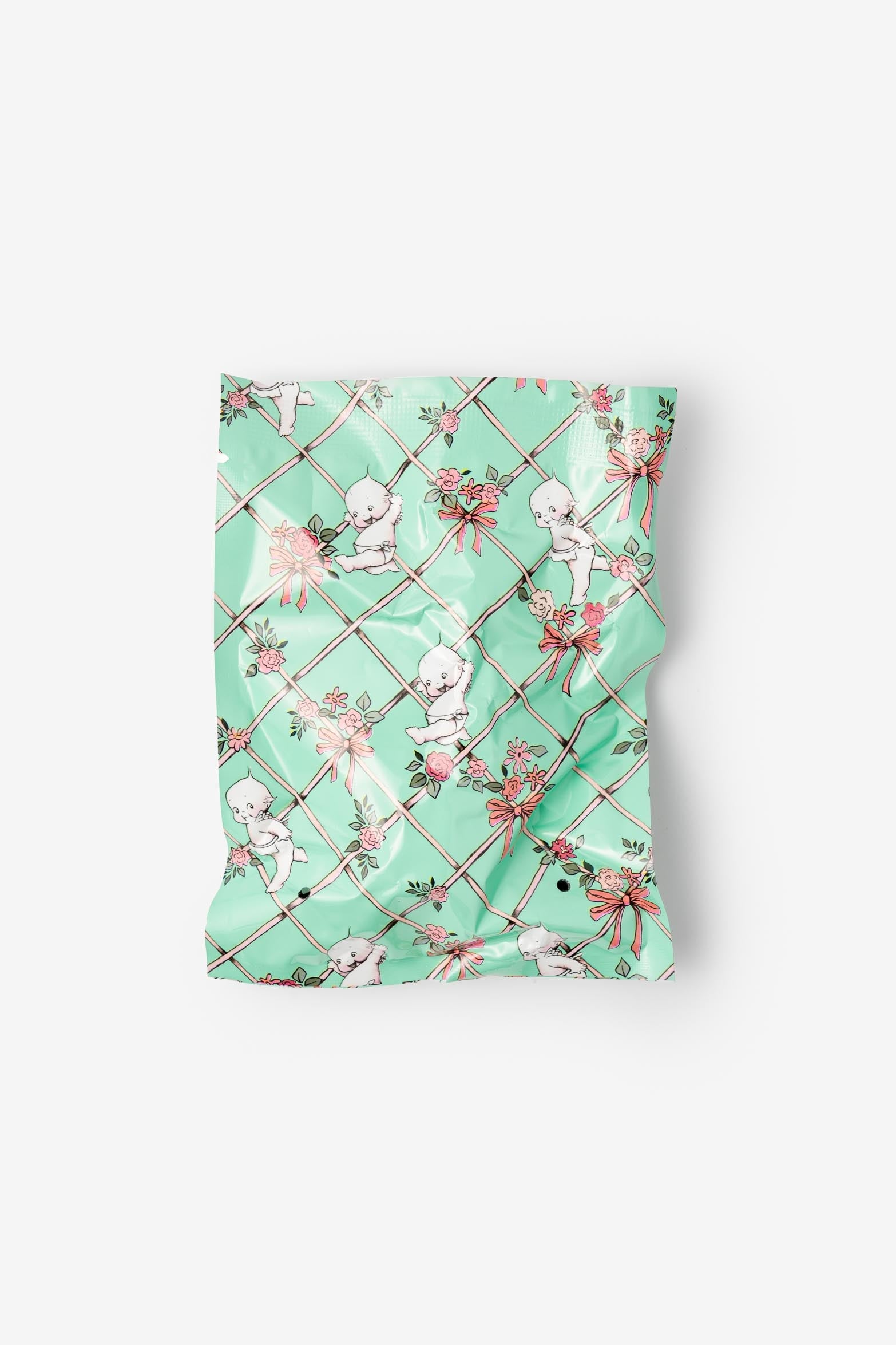 Mint green fabric with cupcake pattern on a white background