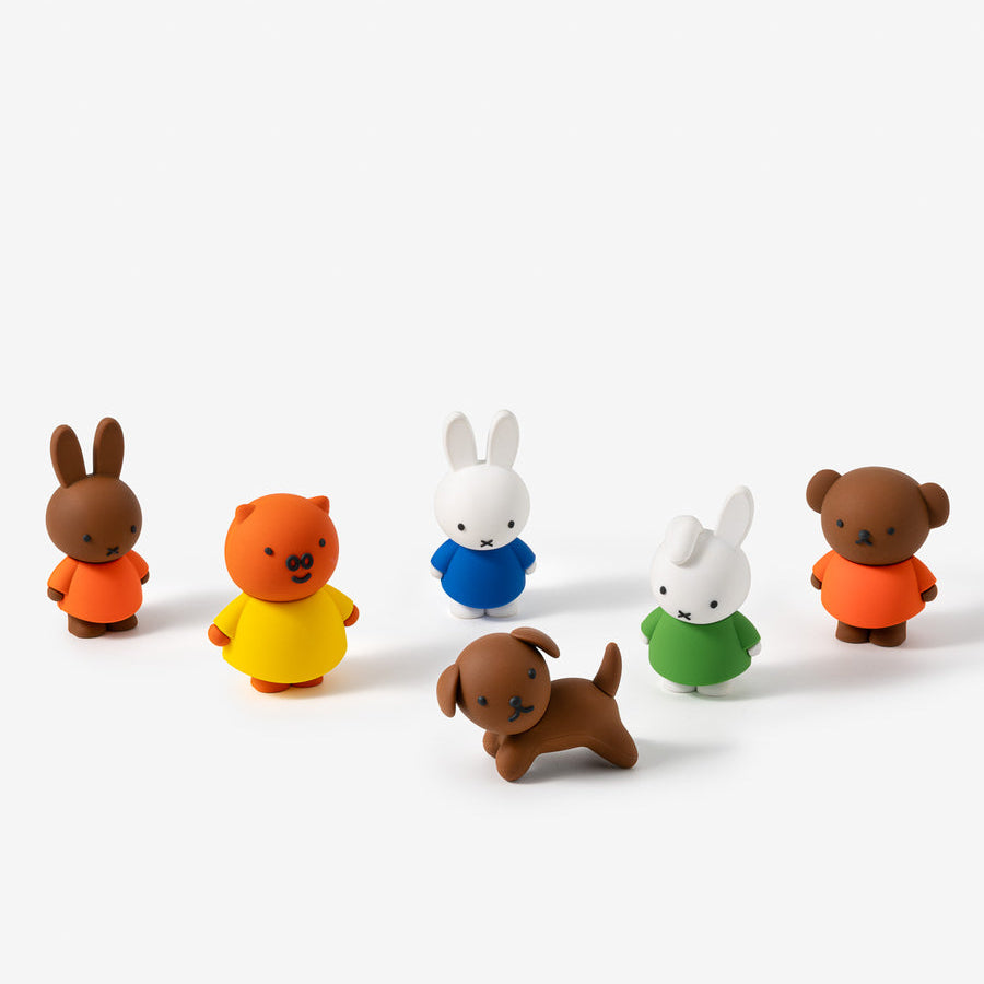 Set of colorful animal figurines on a white background