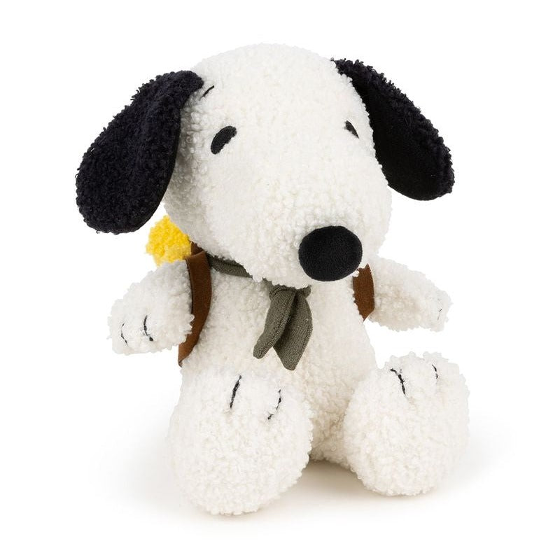 Plush Snoopy dog wearing a backpack and neckerchief.