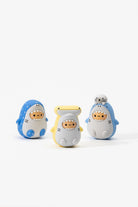 Three cartoon shark figurines with different colors on a white background
