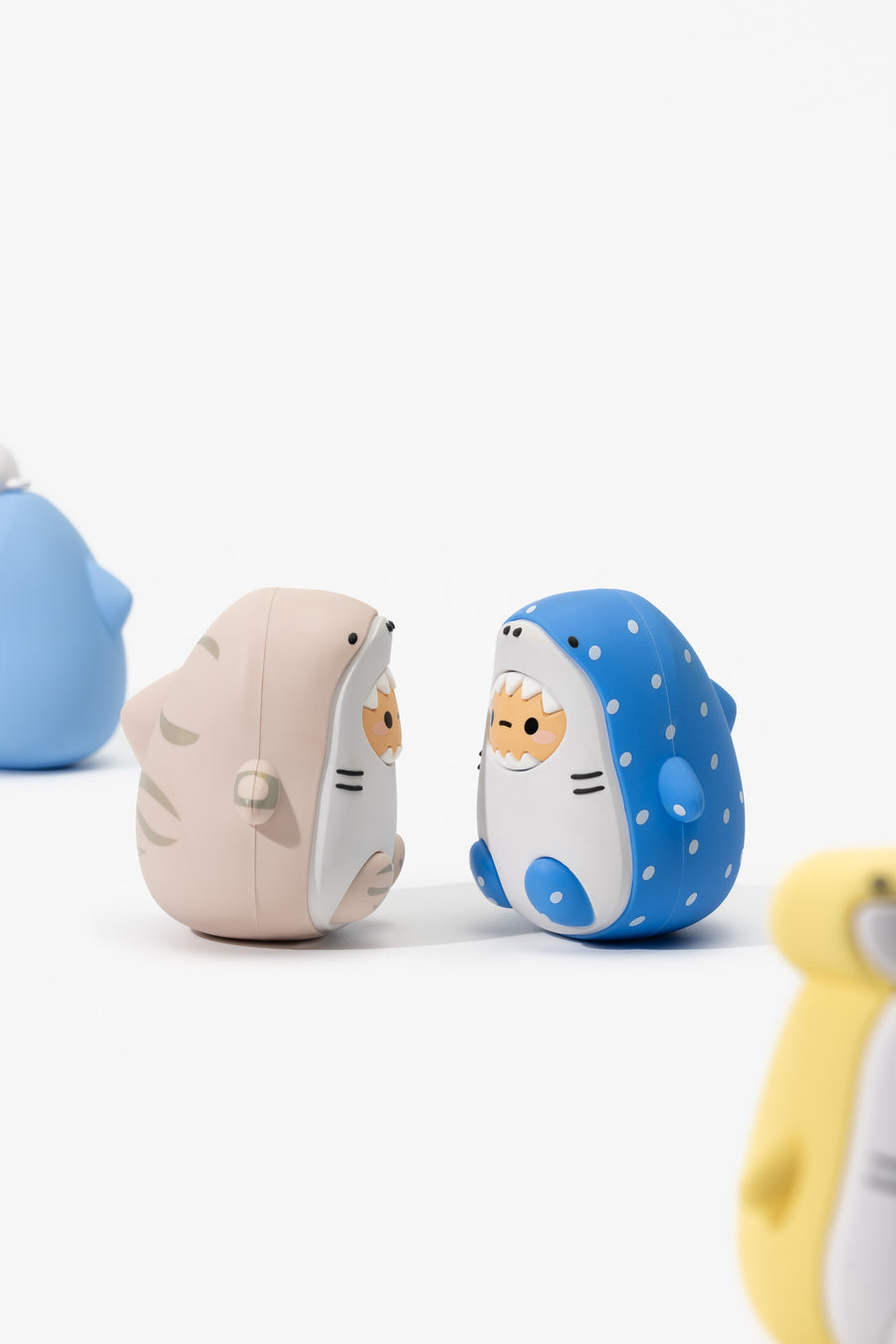 Set of cartoonish animal figurines on a white background