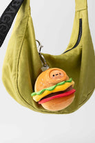 Green bag with a hamburger plush keychain.