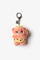 Plush pink caveman keychain with a yellow loincloth and a club.