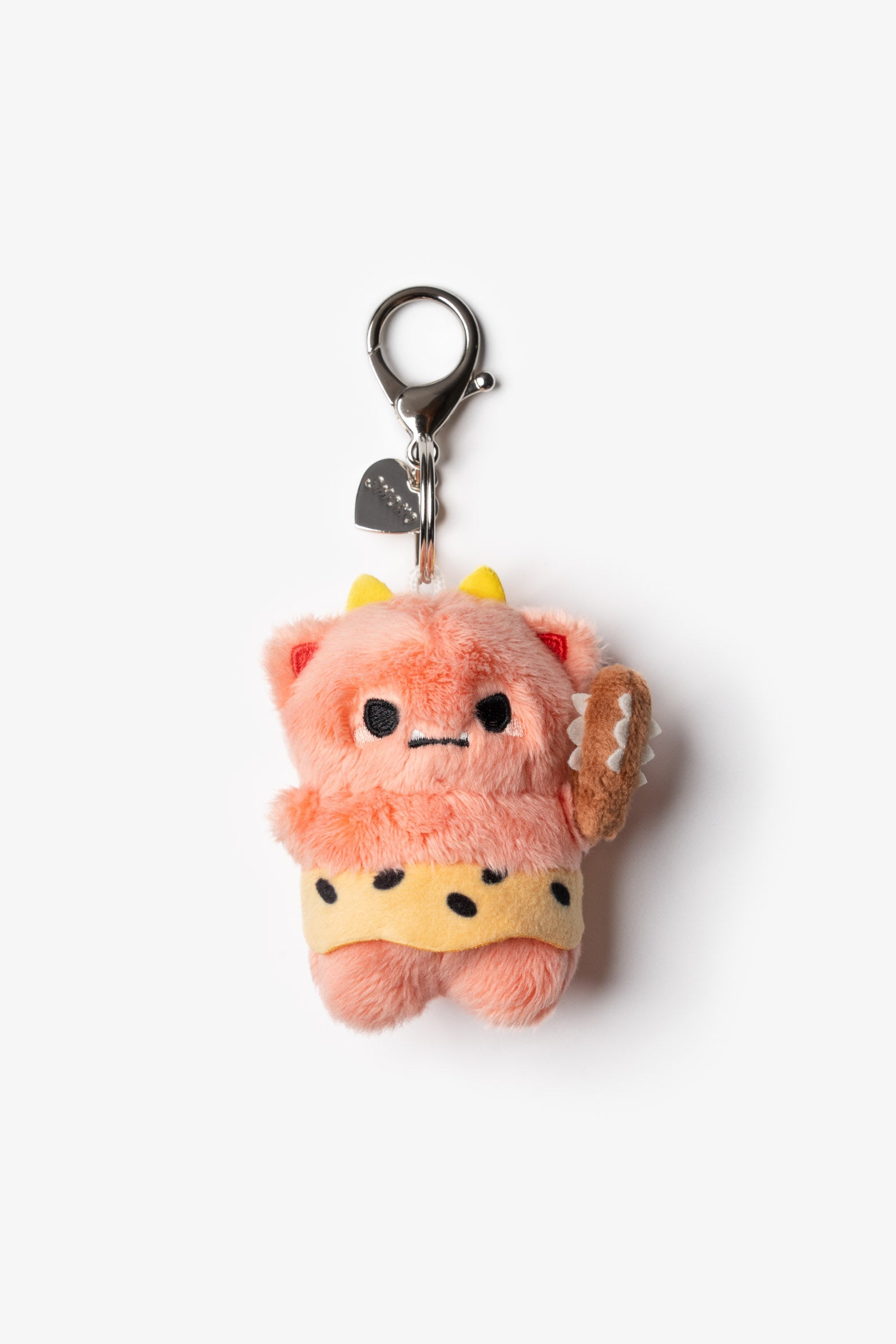 Plush pink caveman keychain with a yellow loincloth and a club.