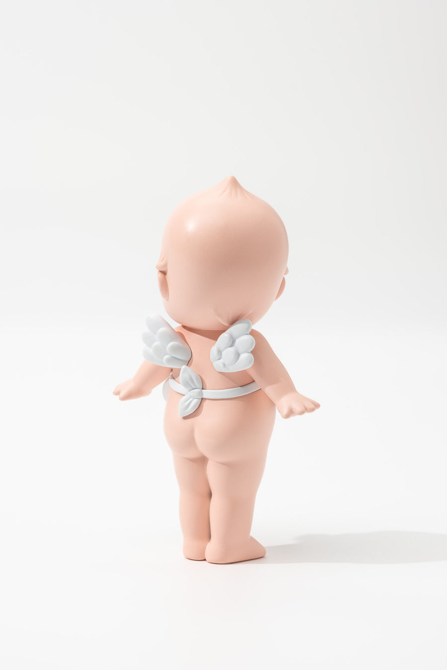 Back photo of baby figure with angel wings