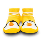 Two yellow baby slipper socks with penguin faces.