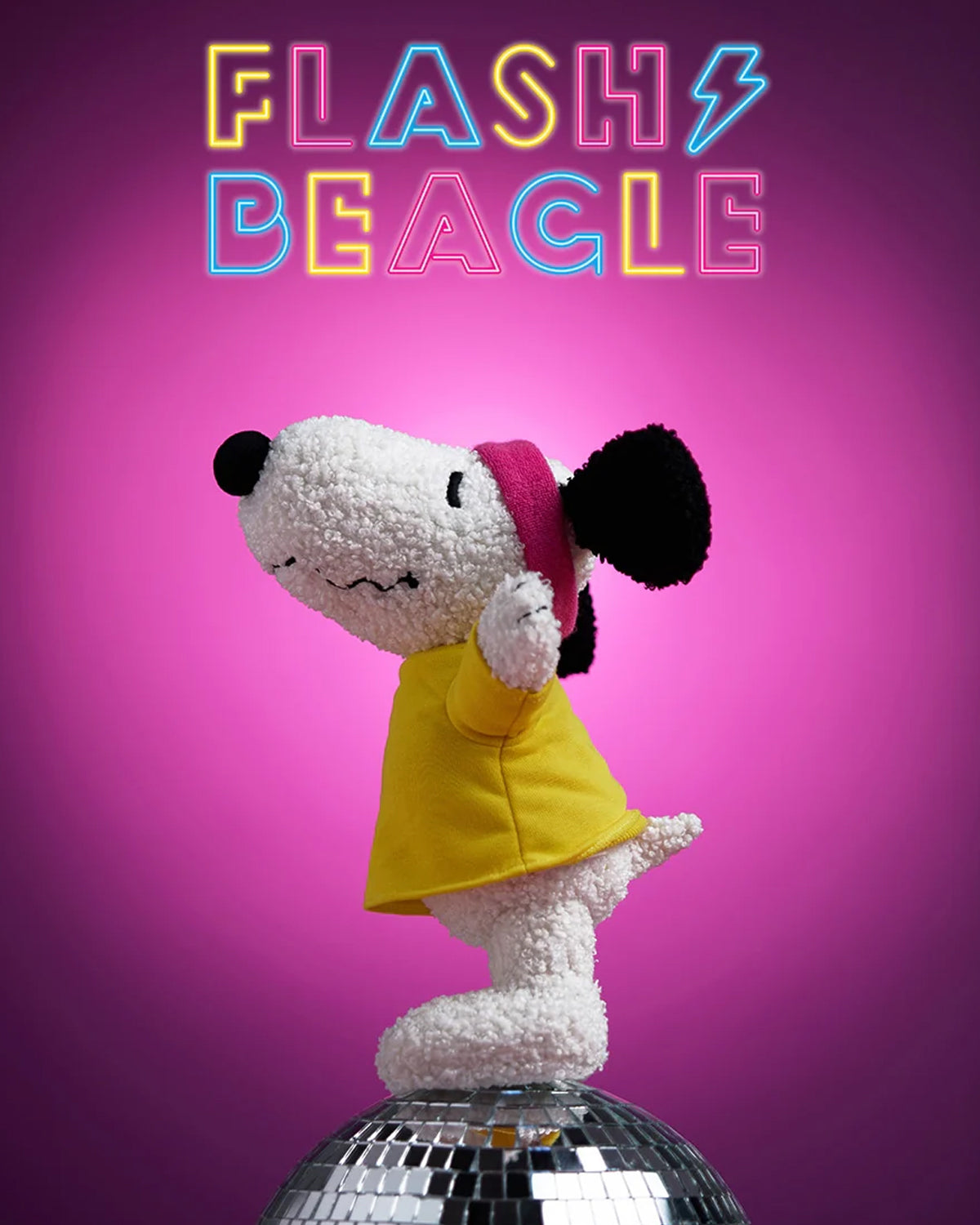 Stuffed Snoopy on a disco ball, wearing a yellow shirt and pink headband, with neon "Flash Beagle" sign.
