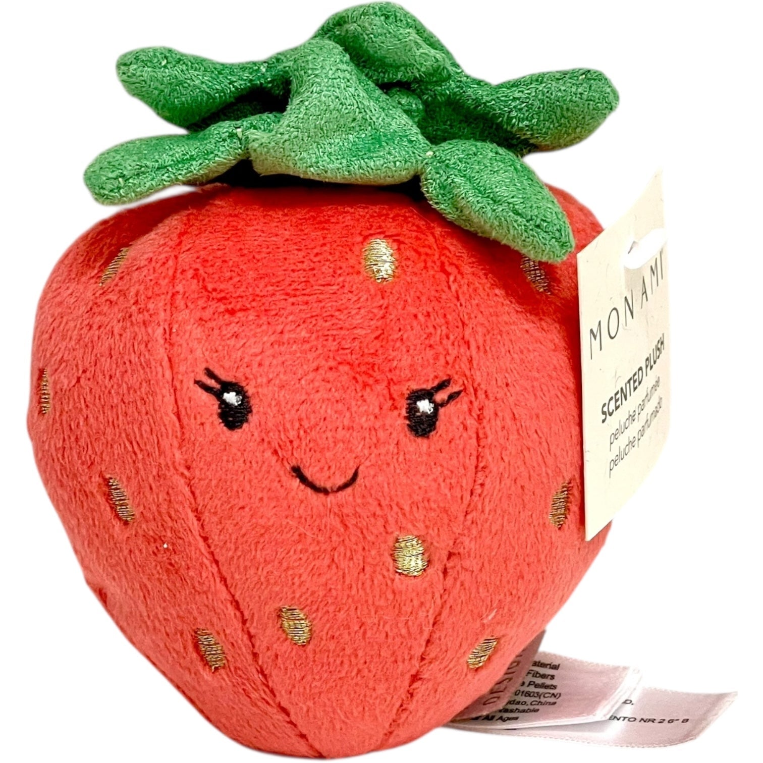 Plush strawberry toy with a smiley face and green leaves on a white background