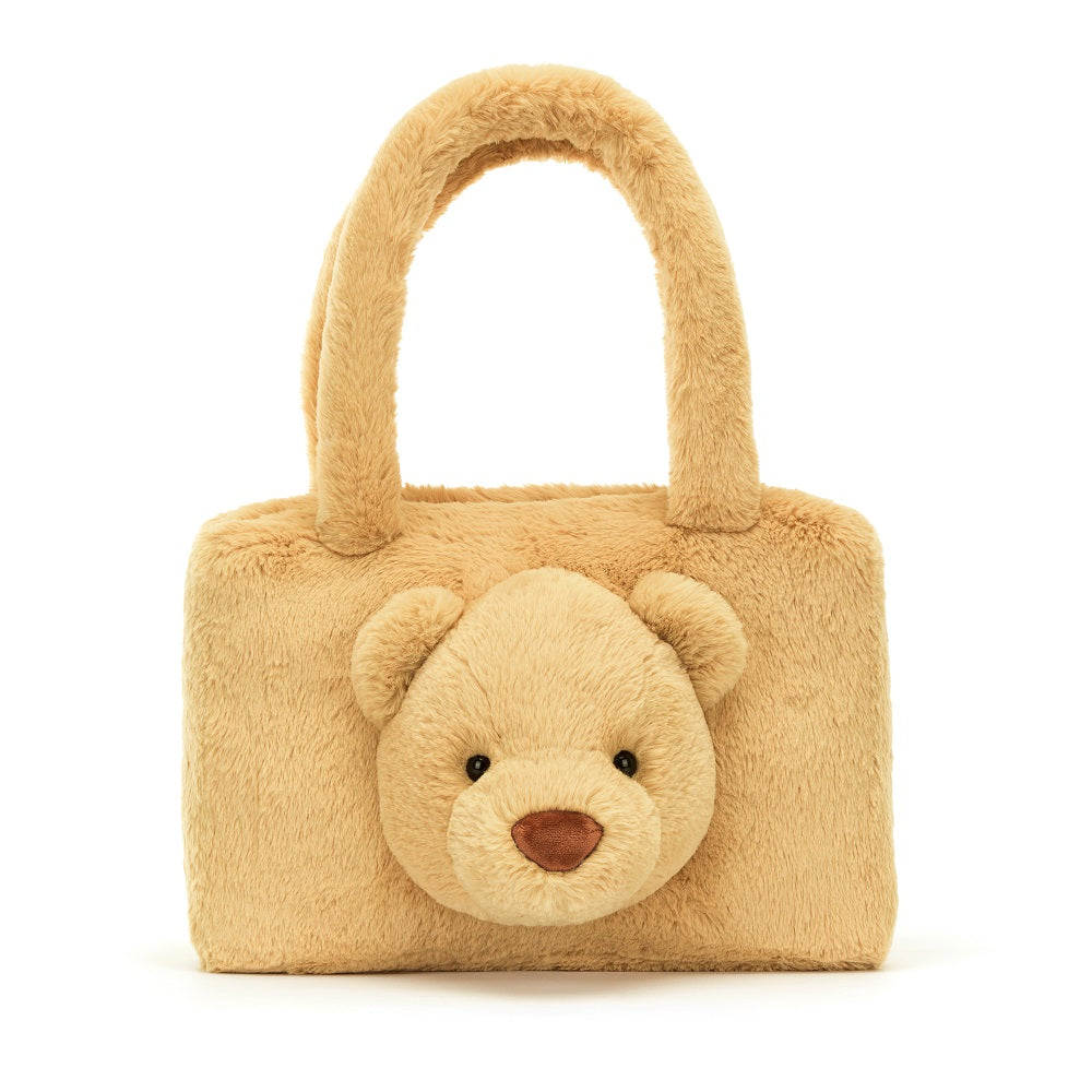 Tan furry teddy bear purse with handles.
