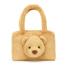 Tan furry teddy bear purse with handles.