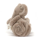 Stuffed elephant toy, soft, brown fur.