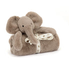 Gray plush elephant toy wrapped in a blanket with a ribbon.