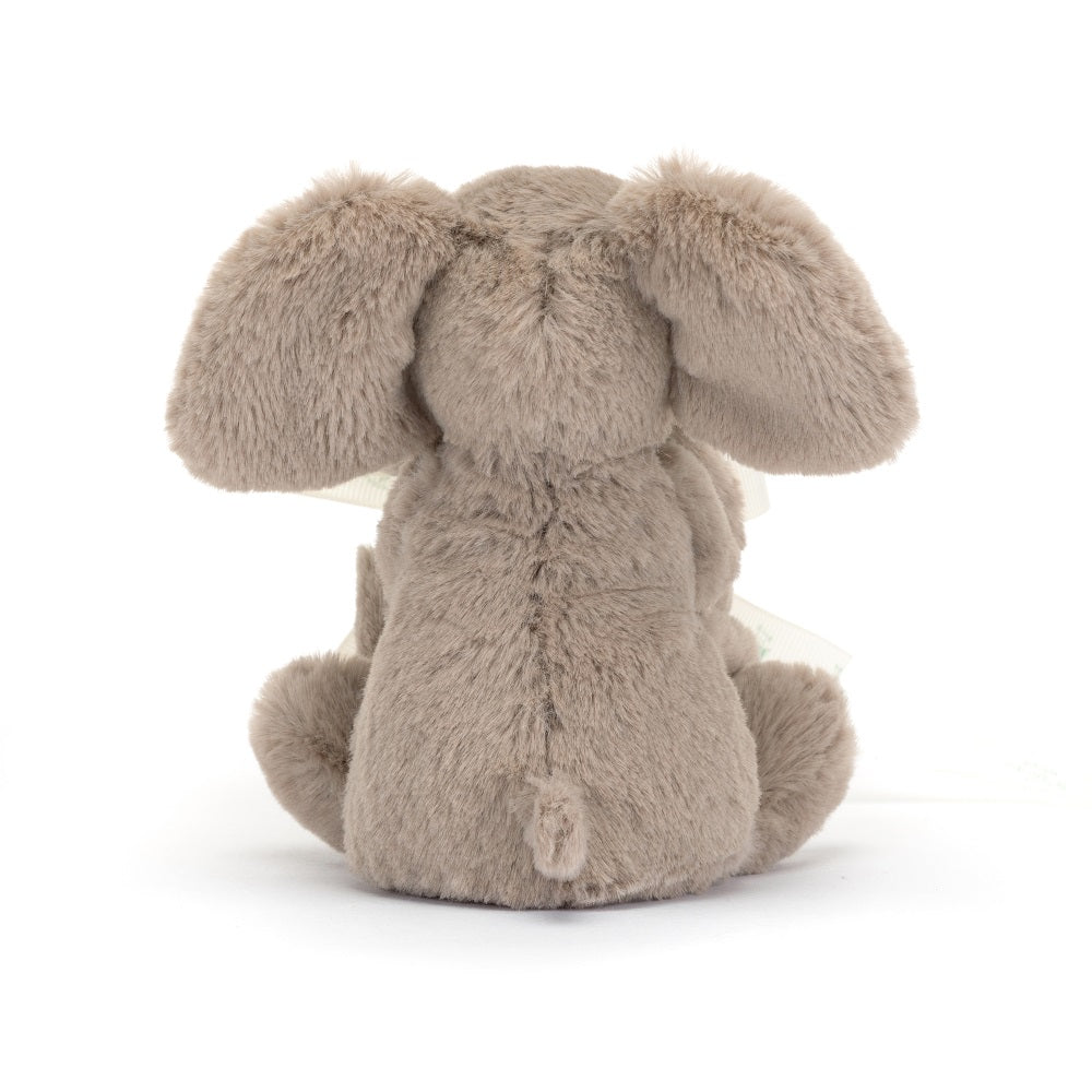 Back view of a gray, plush bunny toy.