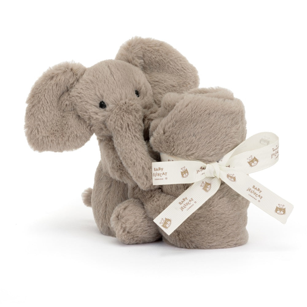 Two gray plush elephants with a ribbon tied around one.