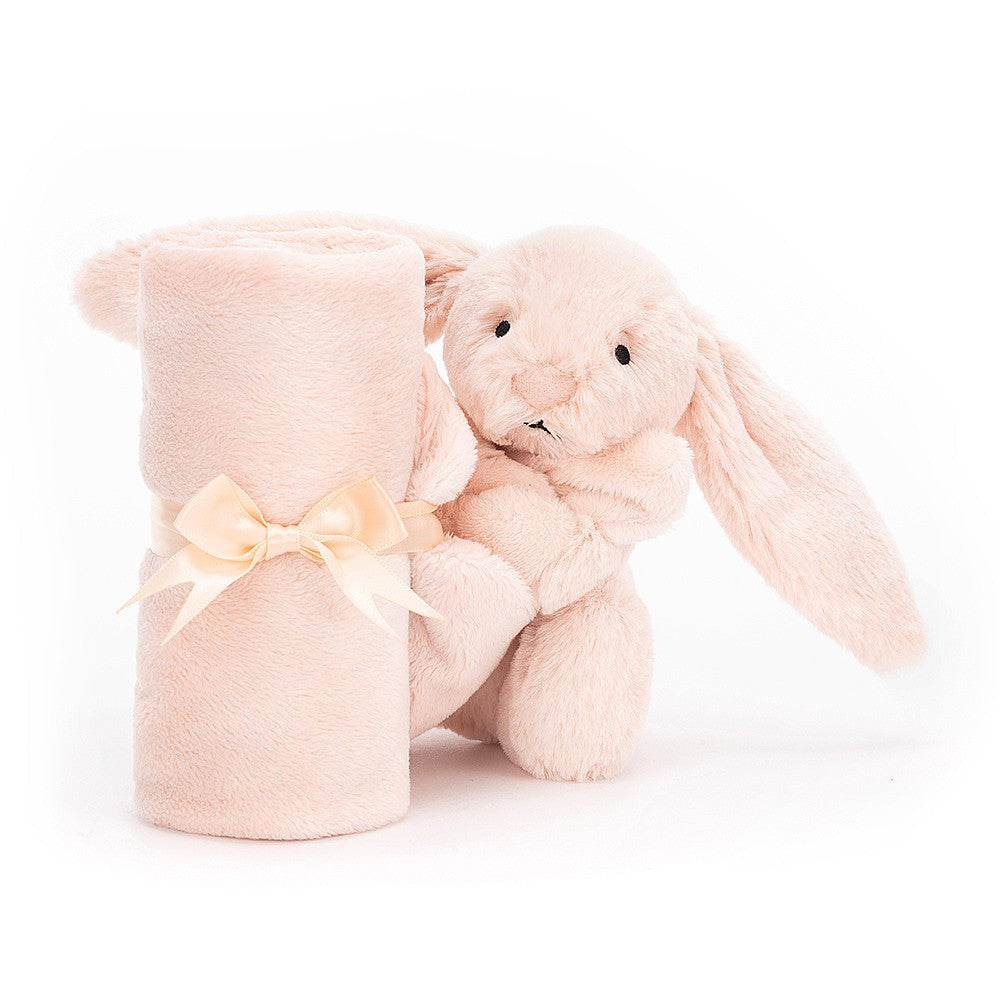 Pink plush bunny and blanket tied with a cream ribbon.