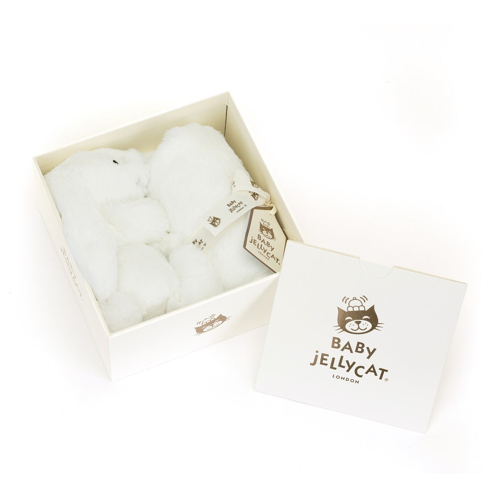 White bunny plush toy in box with tag and lid.