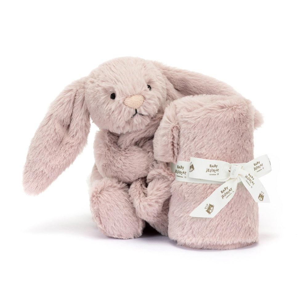 Light pink plush bunny toy with a matching pink blanket tied with a white ribbon.