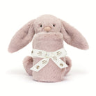 Pink stuffed bunny with a ribbon.