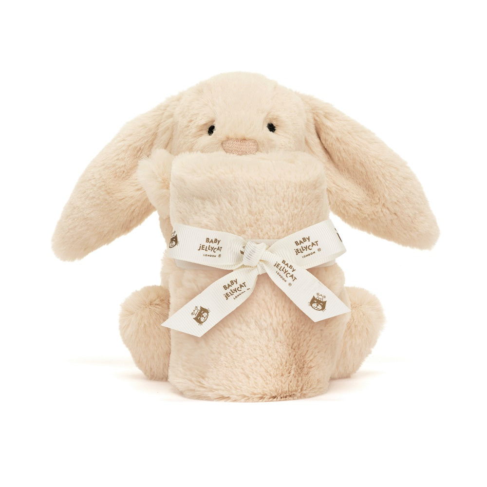 Tan stuffed bunny with a matching roll of fabric, tied with a white ribbon that has "Baby Jellycat" and an owl printed on it.