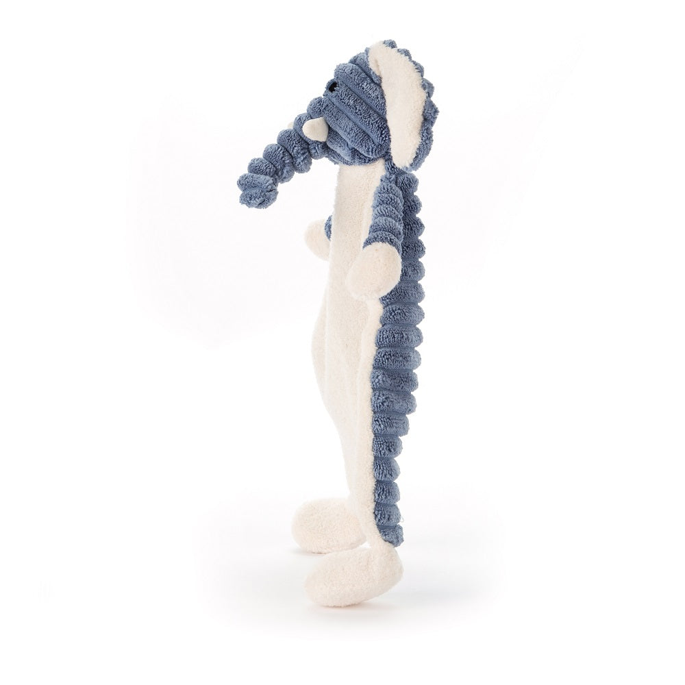Side view of a stuffed blue and white seahorse.