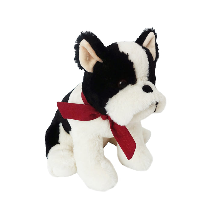 Black and white stuffed dog with red scarf.