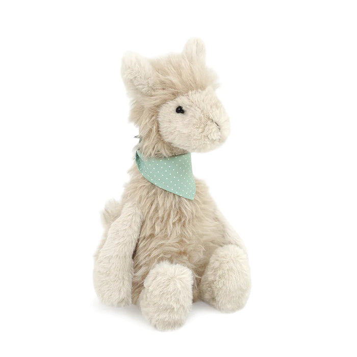 Stuffed alpaca toy with polka dot bandana.