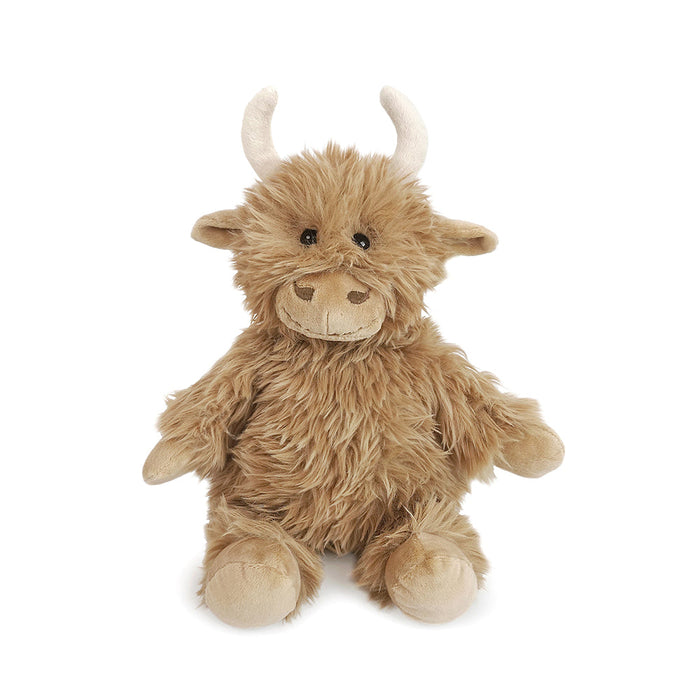 Plush toy highland cow on a white background