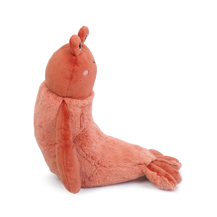 Coral-colored plush shrimp toy, sitting.