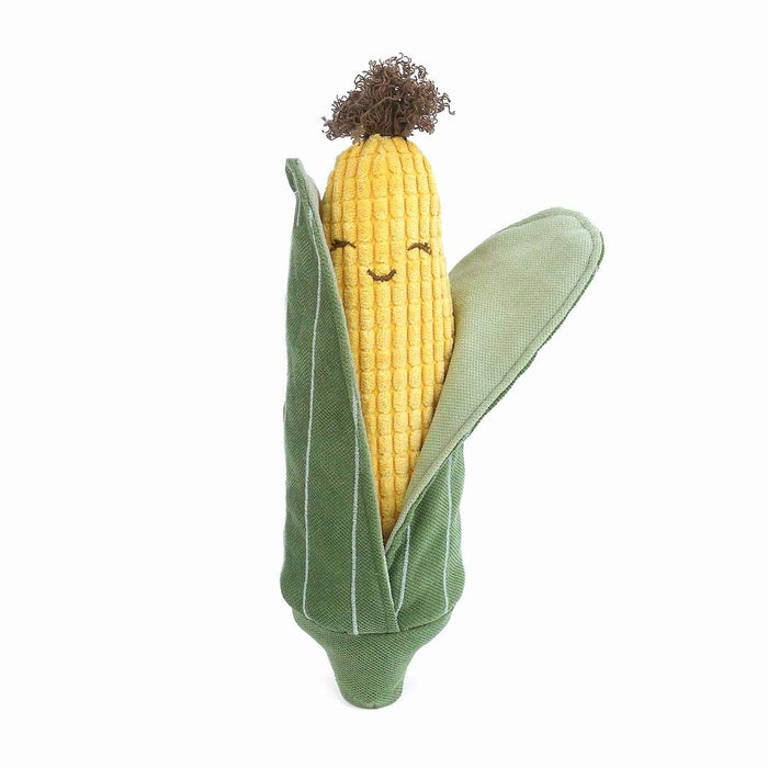 Stuffed corn plush with happy face.