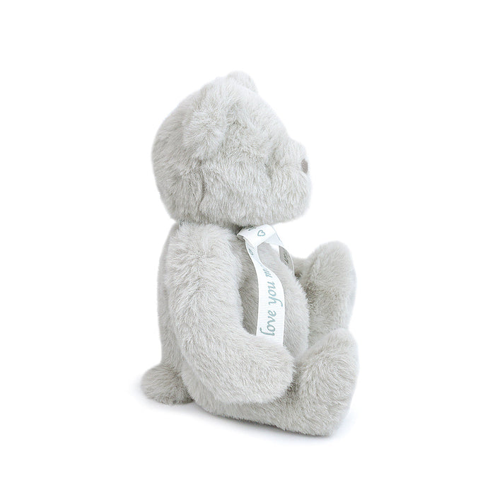 Gray plush bear with a 'love you' tag on a white background