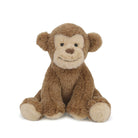 A brown and tan plush monkey sits facing forward.