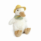 Stuffed white duck with a yellow hat and checkered green scarf, sitting.