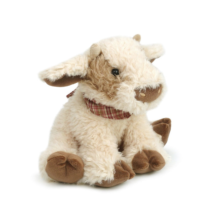 Stuffed, cream-colored cow with brown spots, wearing a plaid scarf.