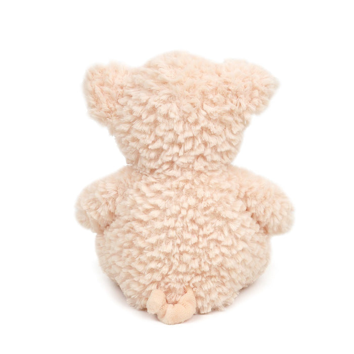 Back of a furry beige plush toy.