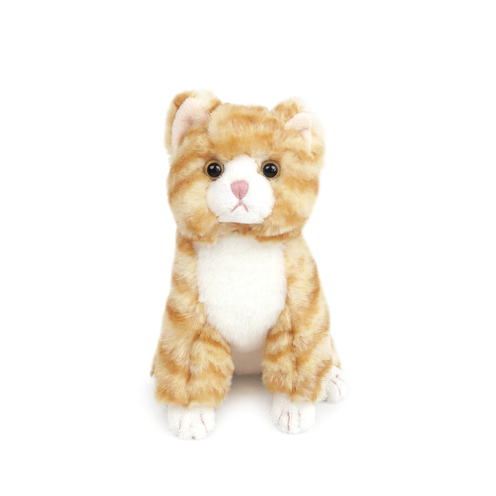 Stuffed orange tabby cat toy sitting.