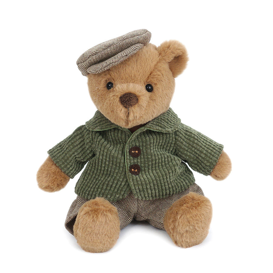 Stuffed teddy bear wearing a newsboy cap, corduroy jacket, and striped pants.