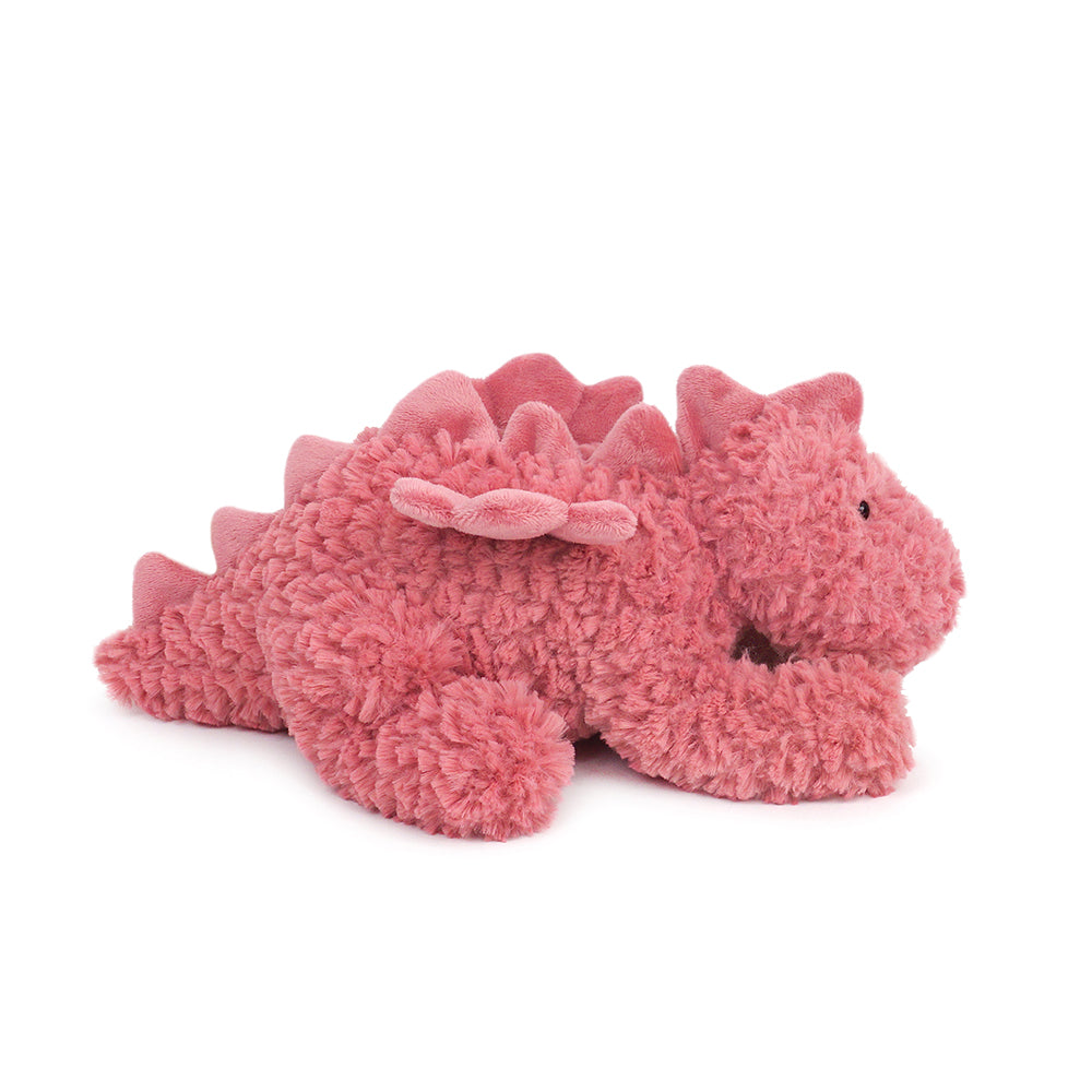 Pink plush dragon toy lying down.